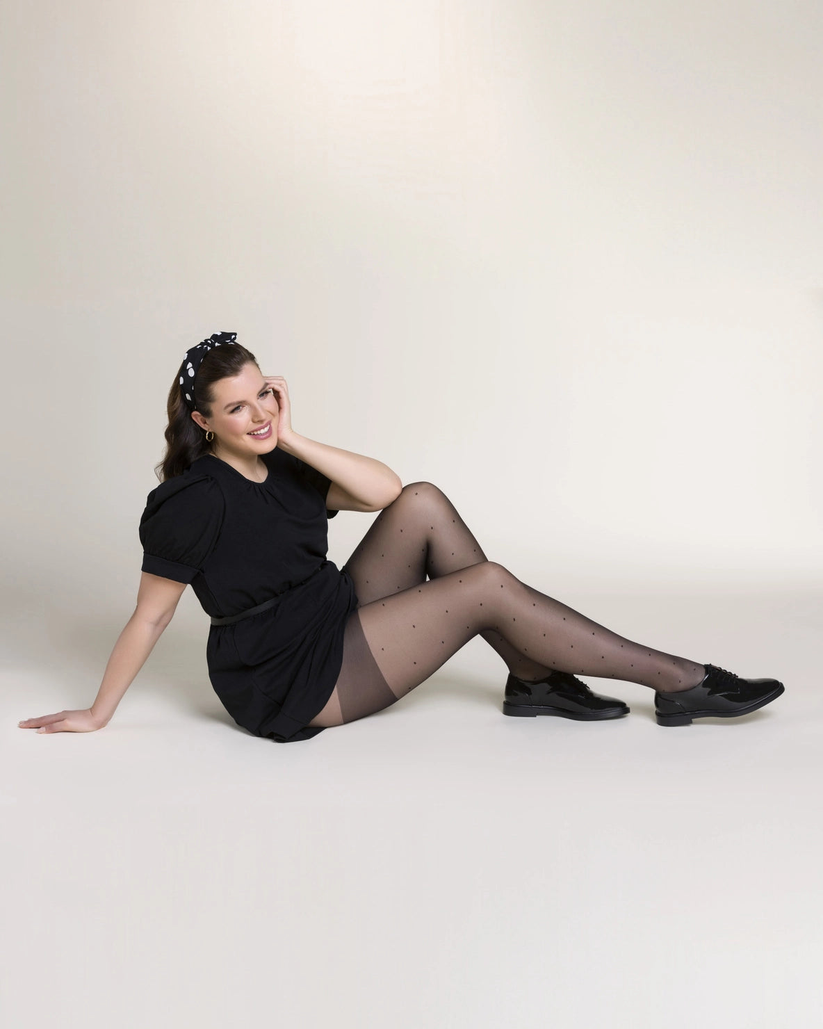 Ohdita black tights with polka dots. Plus size tights designed for curvy women with reinforced thigh area to reduce chafing and increase durability. The best fashion tights for plus size women for all day comfort.