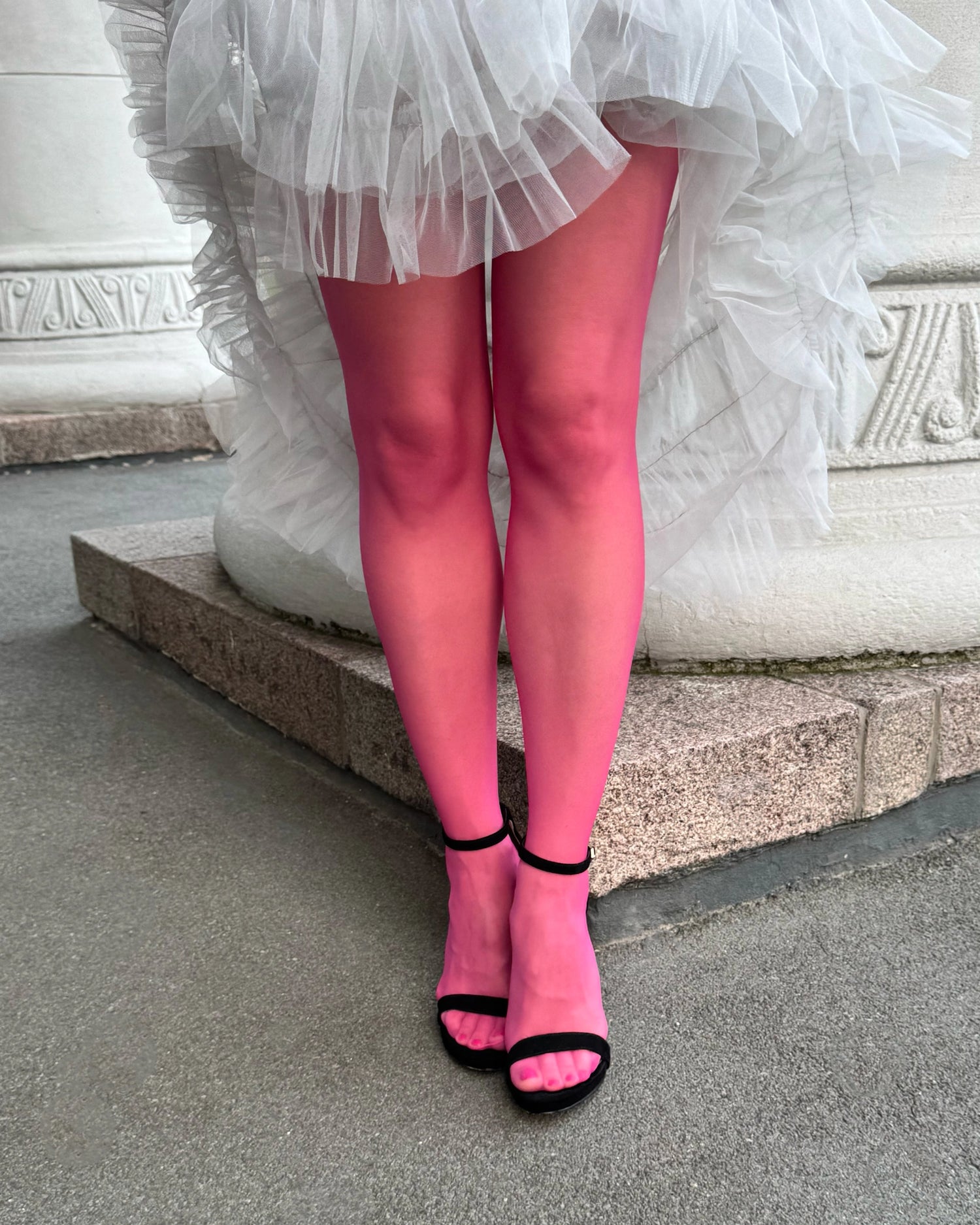 Woman wearing pink tights. Italian pink pantyhose. Fashion tights