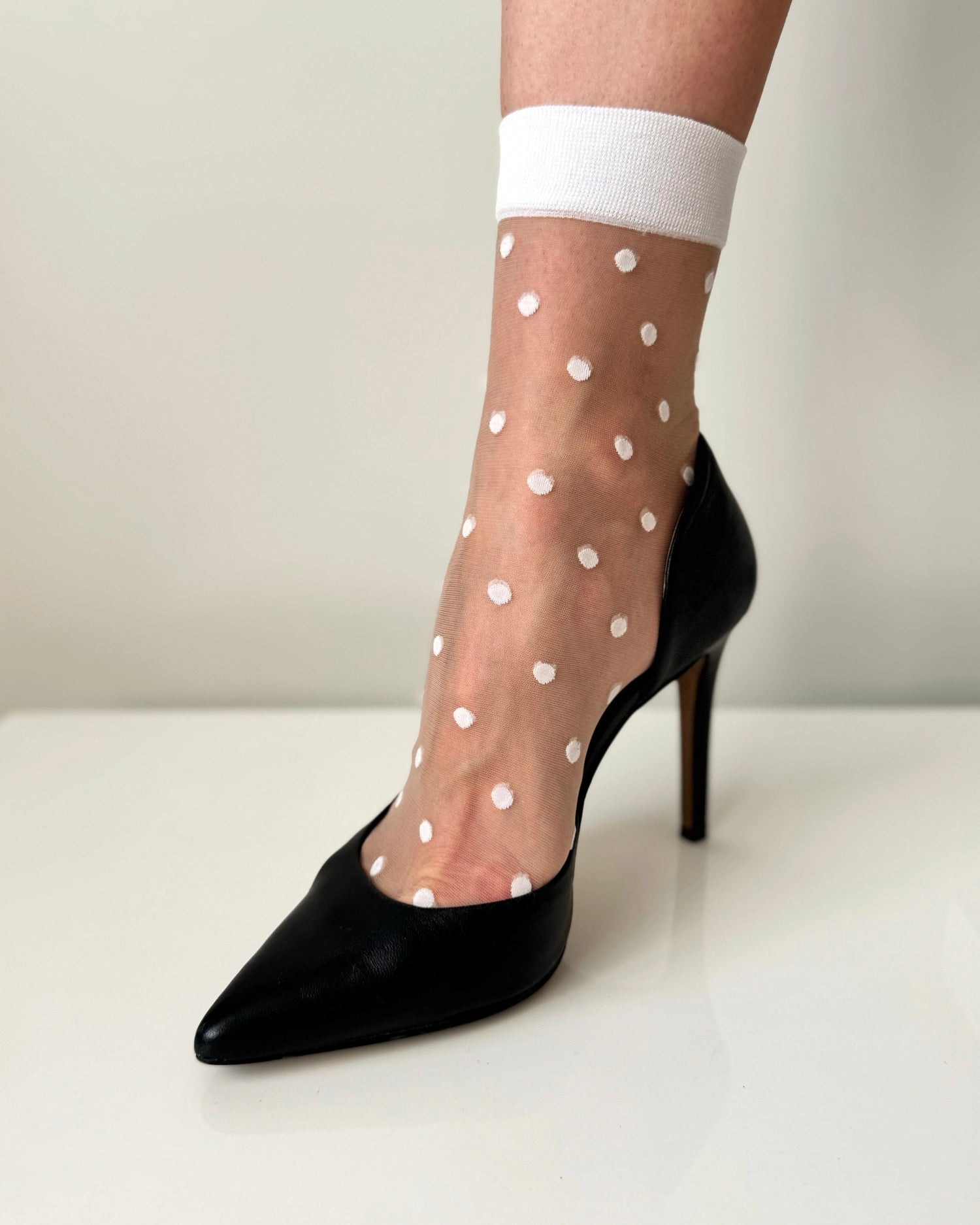 Sheer socks with polka dots. Womens crew socks. White fashion socks.