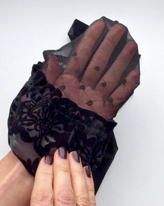 Ohdita sheer black high stockings with lace top featuring dotted pattern at the top of the leg. Fashion stockings