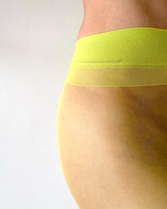 Close-up of a woman wearing sheer green  tights, green pantyhose