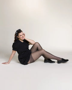 Ohdita black tights with polka dots. Plus size tights designed for curvy women with reinforced thigh area to reduce chafing and increase durability. The best fashion tights for plus size women for all day comfort.