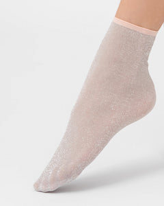 Ohdita shimmer glitter socks. Lightweight pink ankle socks for women. Chic fashion socks for elevated casual outfits and dressy outfits. Pairs well with dresses, skirts, and pants as well as with heels, loafers and sneakers.
