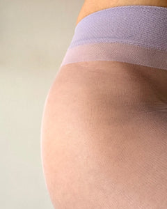 Close-up of a woman wearing sheer lavender tights, colored tights, sheer to waist pantyhose